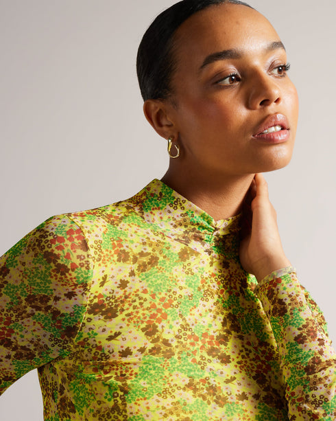 LENNIX-Tops-LENNIX is the ultimate in feminine style. Vibrant colours and a floral print come together in this dainty top, which features a high neckline, long sleeves, and stretch fabric. A wardrobe staple that can be worn with tailored trousers or floaty skirts, team it with a leather jacket to toughen up the look.The fabric of this product is made with 96% recycled polyester. Using recycled polyester helps divert plastic waste from ending in landfills. Mesh top Ditsy Floral print High neck Long sleeved S